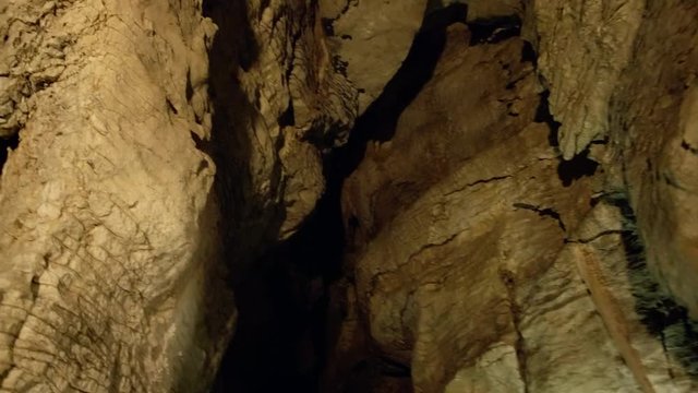 Lit New Zealand cave from wooden viewing platform