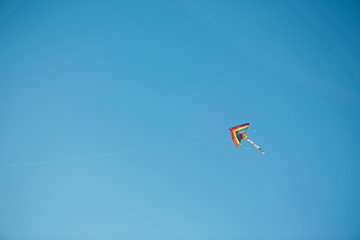 Kite on blue sky.Background.