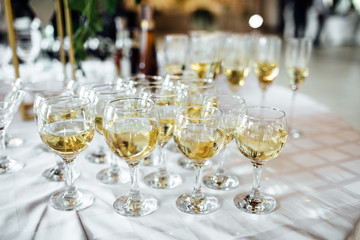 Closeup of glasses of champagne in a row on a table champagne, celebrate, cheer, cocktail, glasses