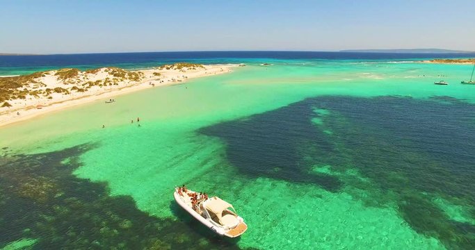 Aerial view of Yatch with friends in amazing, unspoiled and idyllic beach on a little island