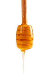 honey with wooden drizzler isolated on white background