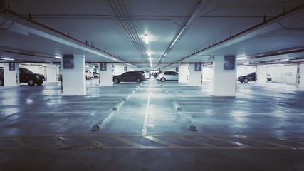 Indoor car parking in shopping center with empty space