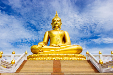 Fototapeta premium Great Golden Buddha statue in the sky in the daytime.