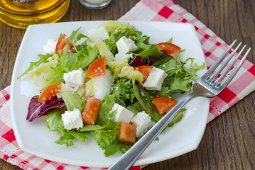 Dietary salad with tomatoes and feta cheese