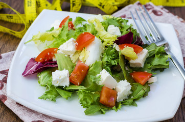 Dietary salad with tomatoes and feta cheese