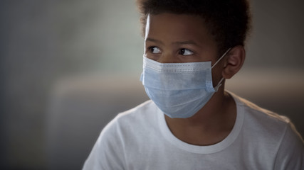 African kid in white shirt wearing protective mask, hospital patient, medicine
