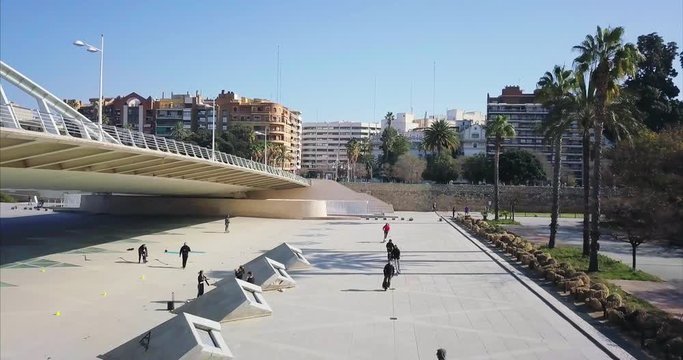 Spain, VALENCIA - February 2018, young people riding on skateboards, rollers in the Park. Gyroscooters. Aerial shooting