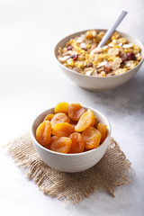 Dried Apricots in a Bowl - With Granola - White Background