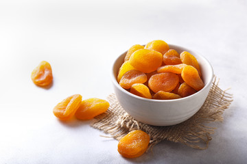 Dried Apricots in a Bowl - White Background