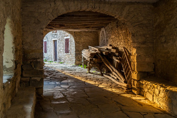 Passageway in old Mediterranean town Draguc - Istria, Croatia