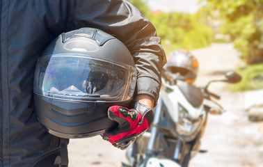 Man in a Motorcycle with helmet and gloves is an important protective clothing for motorcycling...