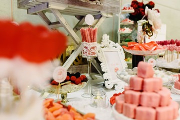 Elegant candy bar for a wedding full of pastries