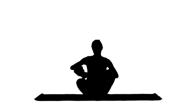 Sporty attractive woman practicing yoga, sitting in Full Lotus exercise, Siddhasana pose, working out track matte