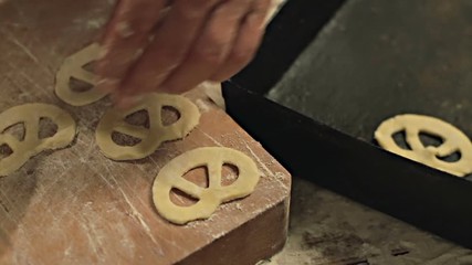 A baker prepares fresh breads and cakes. Shot in Cinestyle color profile (good for color grading). - Powered by Adobe
