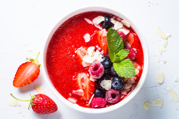 Smoothie bowl with fresh berries and almond. 