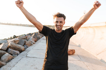 Portrait of a happy sportsman celebrating success
