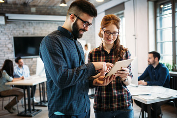 Portrait of architects having discussion in office