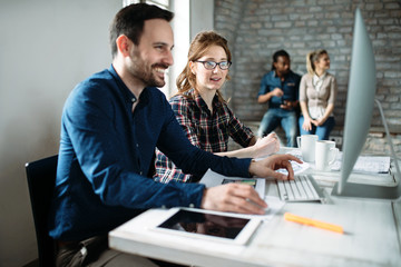 Young architects working on project in office