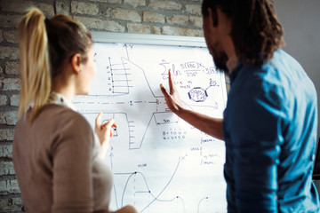 Young architects working on project in office