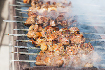 Juicy slices of meat with sauce prepare on fire