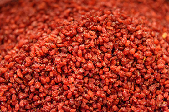 Image of Dried barberry. Herbs and spices in Grand Bazaar in Tabriz. East Azerbaijan province. Fruits and leaves of the ornamental japanese barberry (Berberis thunbergii)