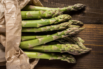 Green Asparagus on Wooden Background with Copy Space