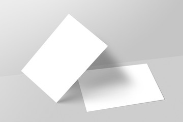Blank business cards on gray background. Mockup for branding identity.