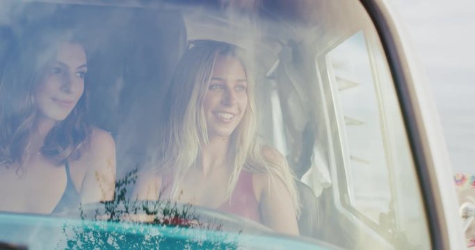 Friends on road trip in vintage surf van