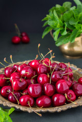 Red cherry on a copper plate