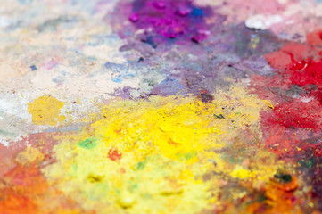 Obraz na płótnie Canvas Various colors on a palette / Abstract background of vibrant colors on a palette.