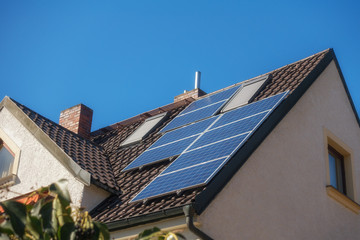 Fototapeta premium a house with photovoltaic cells on the roof