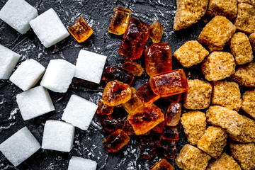 lumps of sugar for sweets on kitchen table background top view p