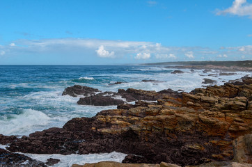 Fototapeta na wymiar Indian ocean and rocks Cape St Francis