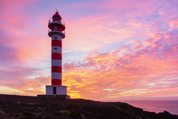 Sunset view of the lighthouse of Sardina on the island of Gran Canaria, spain