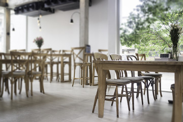 Fototapeta na wymiar Wooden dining table in coffee shop