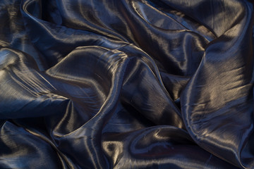 Fototapeta premium Smooth elegant blue silk. To be used as background.