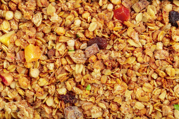 Homemade roasted granola on baking sheet breakfast food background