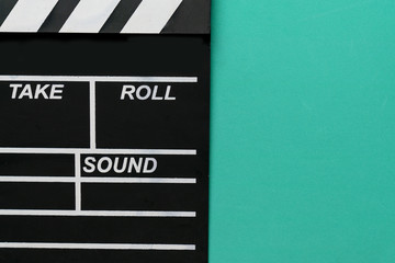 movie clapper on green background ; film, cinema and video photography concept