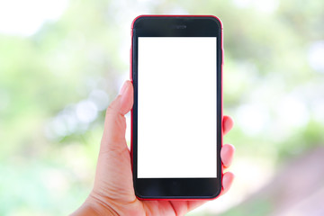 Fototapeta na wymiar Woman Hand Holding The White Smartphone With Blank Screen