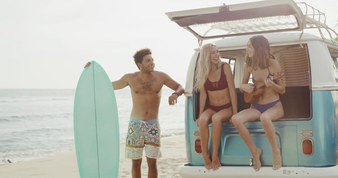Friends laughing and having fun at the beach, summer lifestyle