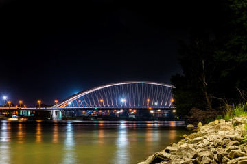 Bratislava, Slovakia May 23, 2018: Apollo bridge over river Danube in Bratislava with reflection on water.