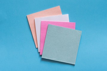 colorful sticky notes on light blue background,