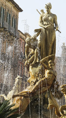 Famous Artemis (Diana) Fountain on Archimedes Square on the Ortygia isle, Sicily, Italy