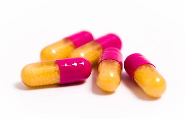 Tablets and capsules isolated on a white background  a variety of medicinal medications for female and male health, biodegradable supplements and vitamins for heart health and contraceptives  