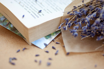 Beautiful bouquet of dry lavender flowers and opened book