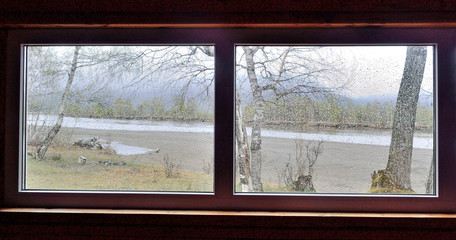 Plakat view from the window to the river on a rainy day