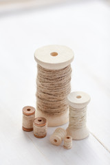 Wooden bobbins isolated on a white background