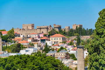 Fototapeta na wymiar View of rooftops and Grand master palace in background from city walls (Rhodes, Greece)