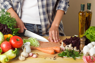 Woman cooks at the kitchen