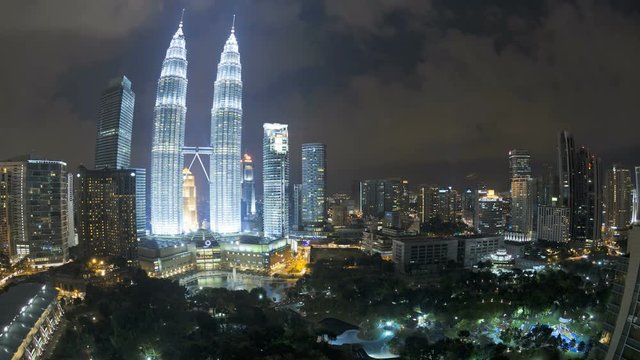 Wide angled illuminated nighttime view of the Petronas Twin Towers, Kuala Lumpur City Centre KLCC, Malaysia, Kuala Lumpur, Asia, Time lapse